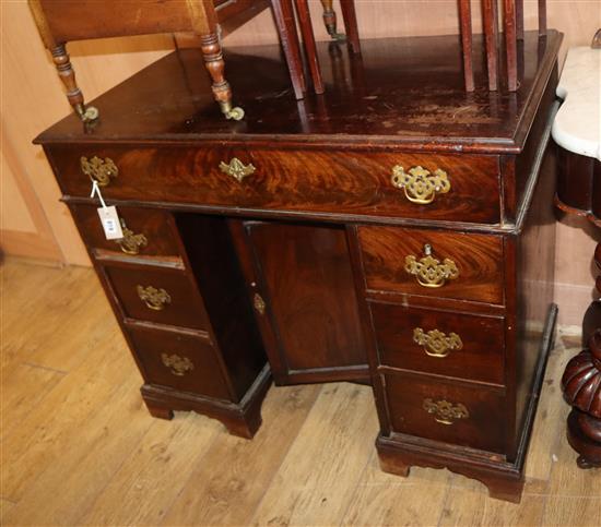A George III mahogany kneehole desk W.94cm